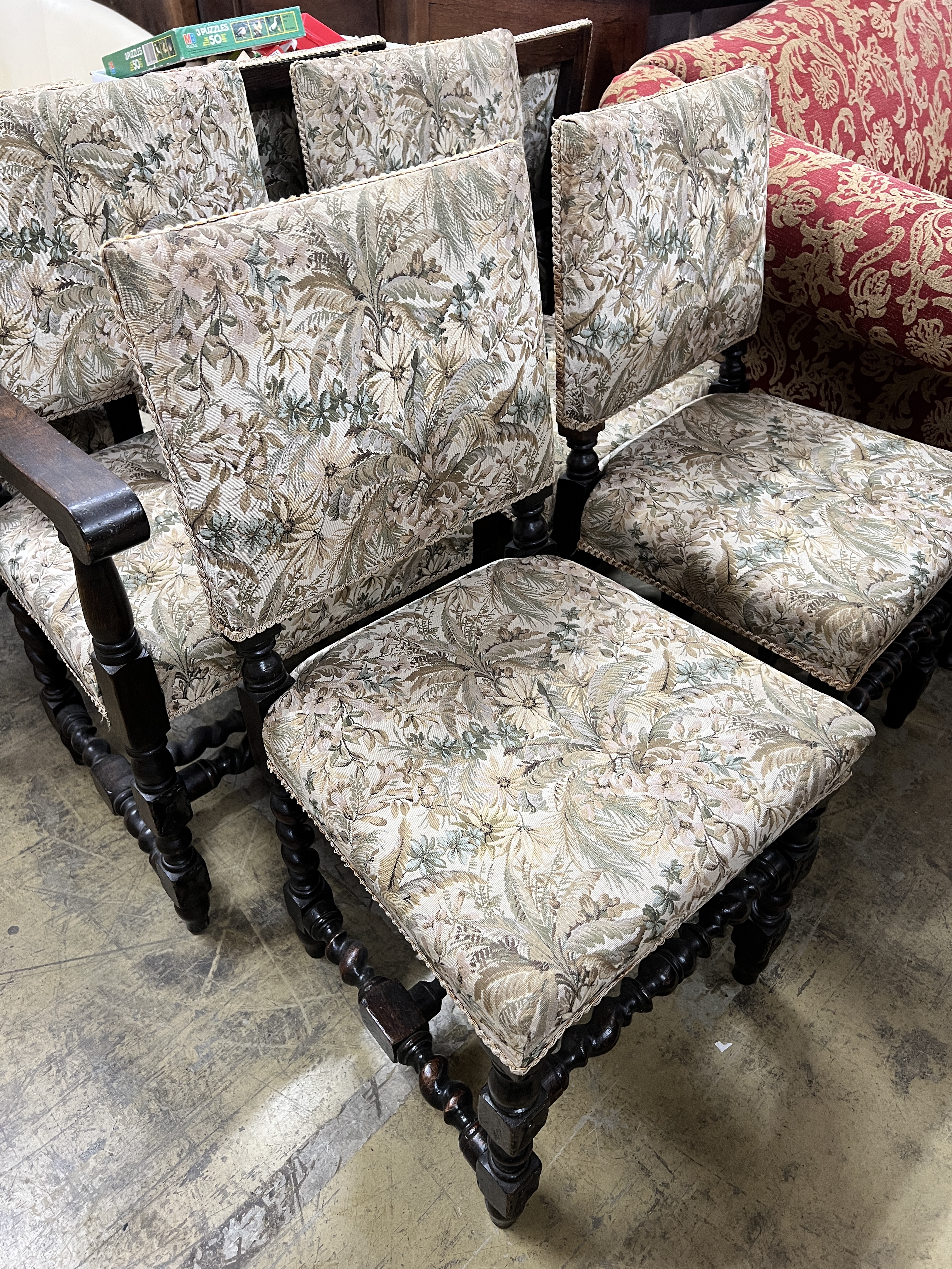 A set of seven 18th century style oak dining chairs, two with arms